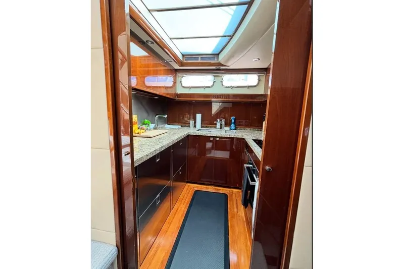 Slide: The Image of Luxurious kitchen interior of 2009 Princess 85 Motor Yacht with wood finish and granite countertops. - 7