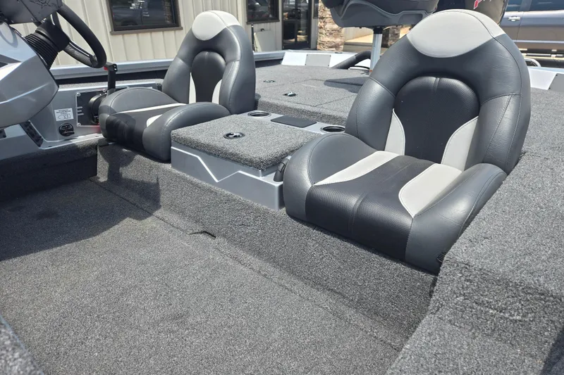 Slide: The Image of 2023 Vexus AVX1980C boat interior with dual black and gray seats. - 19