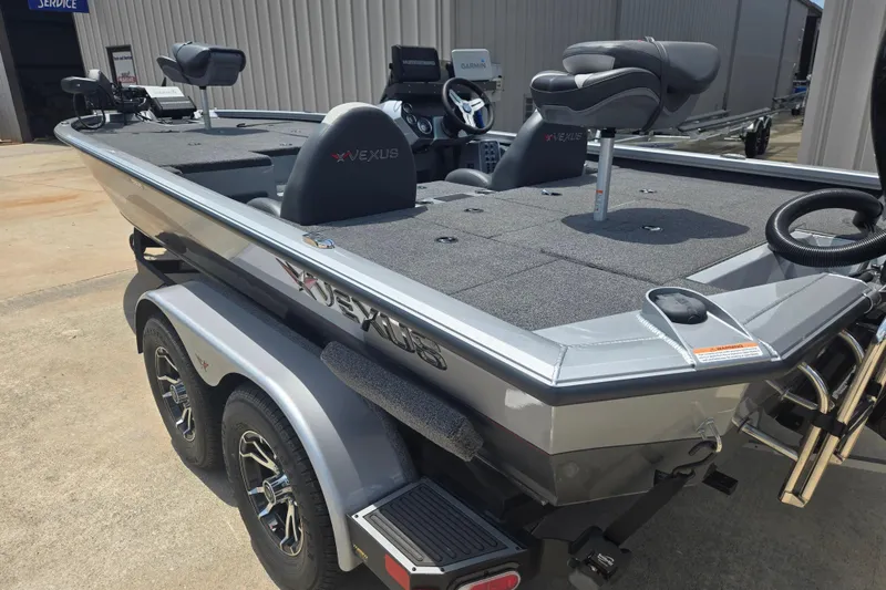 Slide: The Image of 2023 Vexus AVX1980C fishing boat with dual seats and modern design on a trailer. - 16