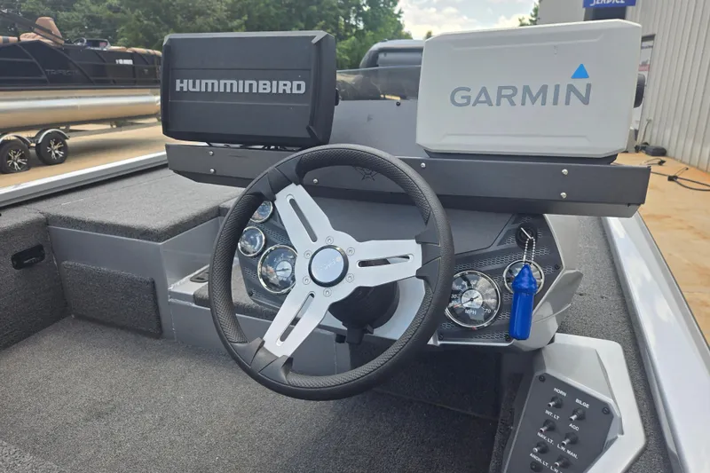 Slide: The Image of 2023 Vexus AVX1980C boat dashboard with Humminbird and Garmin navigation systems. - 11