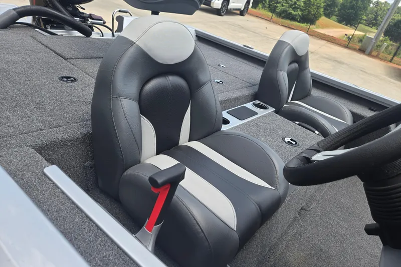 Slide: The Image of 2023 Vexus AVX1980C boat interior with gray and black seating, steering wheel, and console. - 12