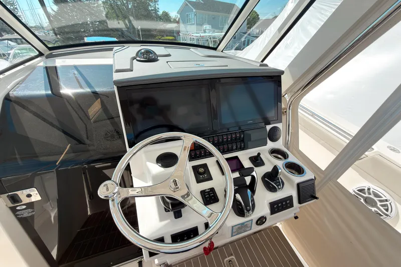 Slide: The Image of Helm of 2023 Pursuit S 378 Sport boat with modern controls and navigation screens. - 3