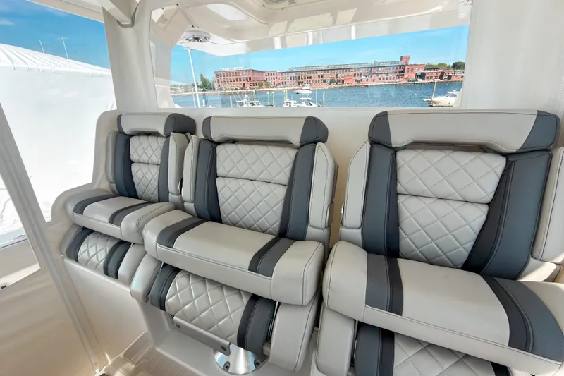 Slide: The Image of Luxurious seating on 2023 Pursuit S 378 Sport boat with waterfront view. - 4
