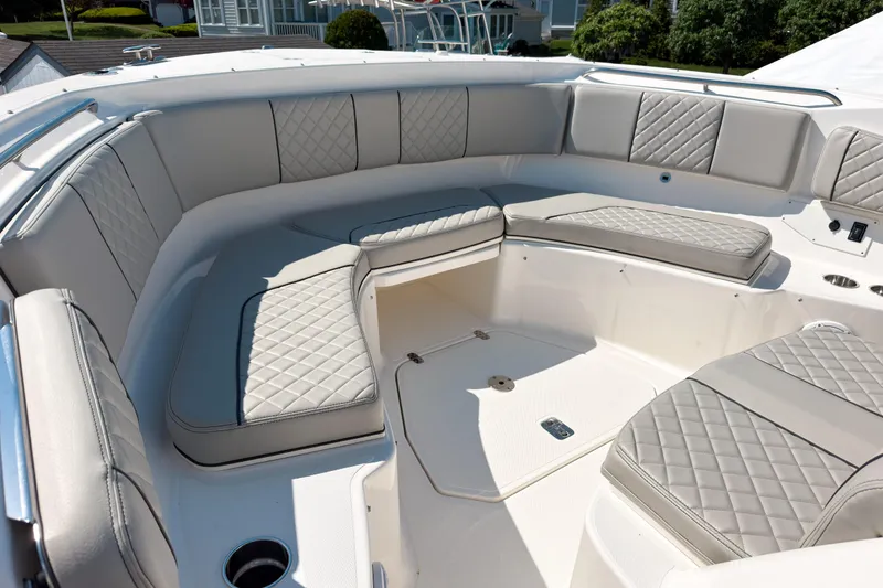 Slide: The Image of Luxurious seating area on 2023 Pursuit S 378 Sport boat, featuring quilted upholstery. - 6