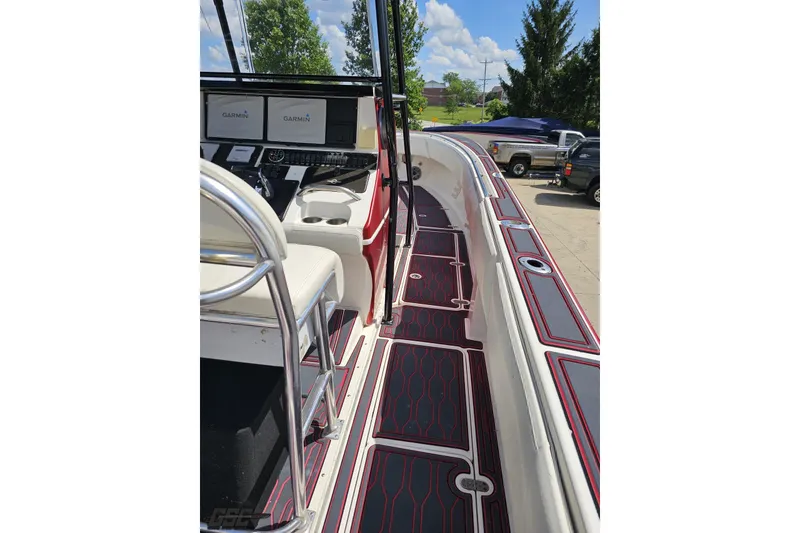 Slide: The Image of 2005 Fountain 34 Sportfish CC Open Bow with Garmin displays and stylish deck design. - 61