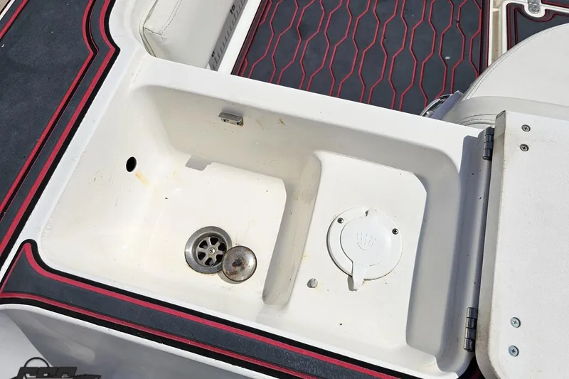 Slide: The Image of 2005 Fountain 34 Sportfish CC Open Bow boat sink with drain and cover. - 42