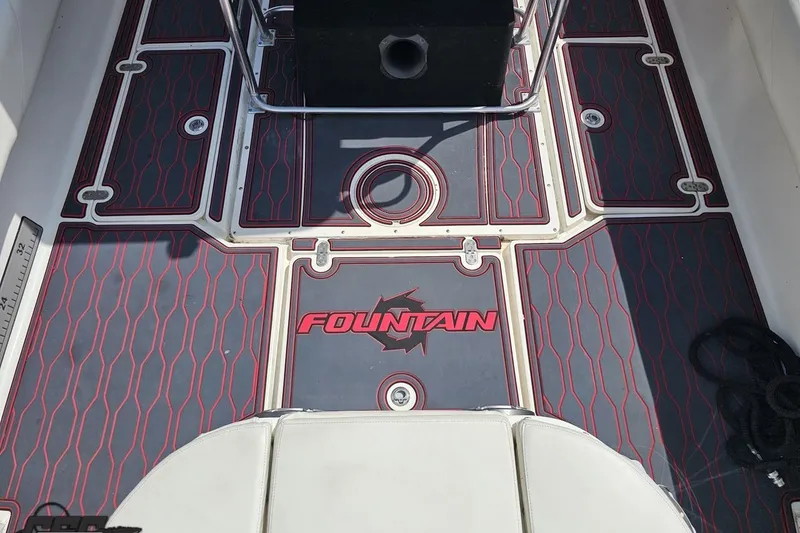 Slide: The Image of 2005 Fountain 34 Sportfish CC Open Bow boat deck with custom flooring design. - 50