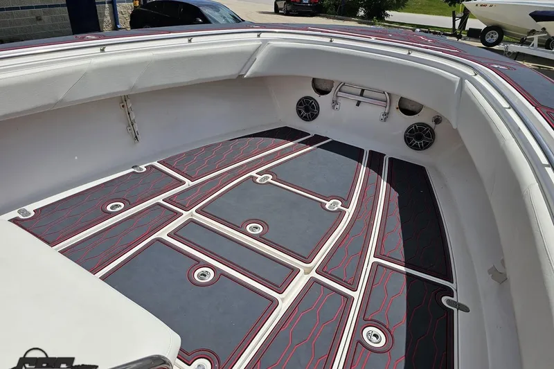 Slide: The Image of Open bow of 2005 Fountain 34 Sportfish CC with custom flooring and speakers. - 77