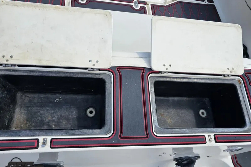 Slide: The Image of Open storage compartments on a 2005 Fountain 34 Sportfish CC Open Bow boat. - 43