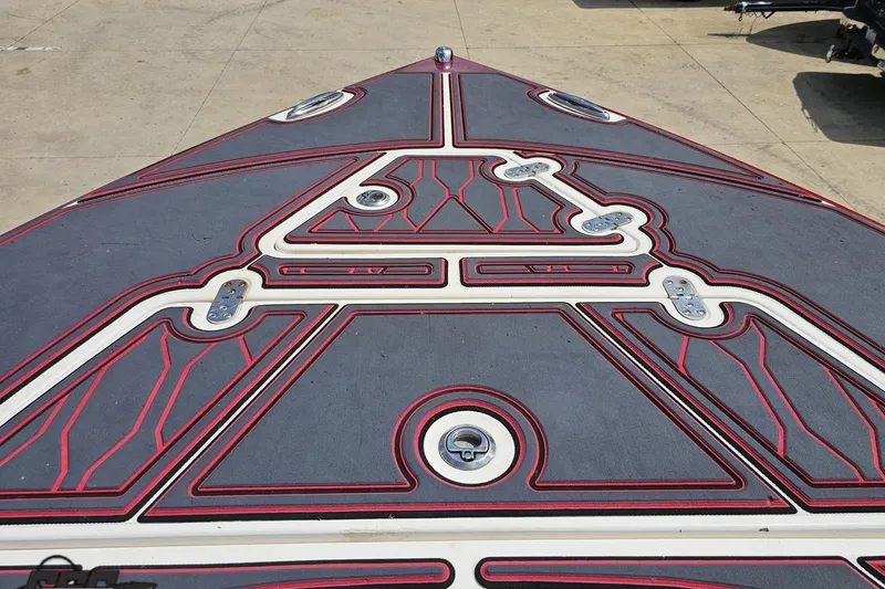 Slide: The Image of Bow deck of 2005 Fountain 34 Sportfish CC Open Bow with custom red and gray design. - 78