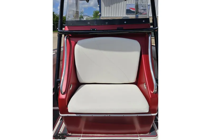 Slide: The Image of Red and white seating on a 2005 Fountain 34 Sportfish CC Open Bow boat. - 82