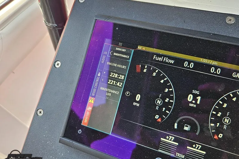 Slide: The Image of Close-up of a 2005 Fountain 34 Sportfish CC Open Bow dashboard display showing engine hours and fuel flow. - 66