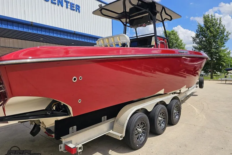Slide: The Image of 2005 Fountain 34 Sportfish CC Open Bow in vibrant red on a trailer. - 9