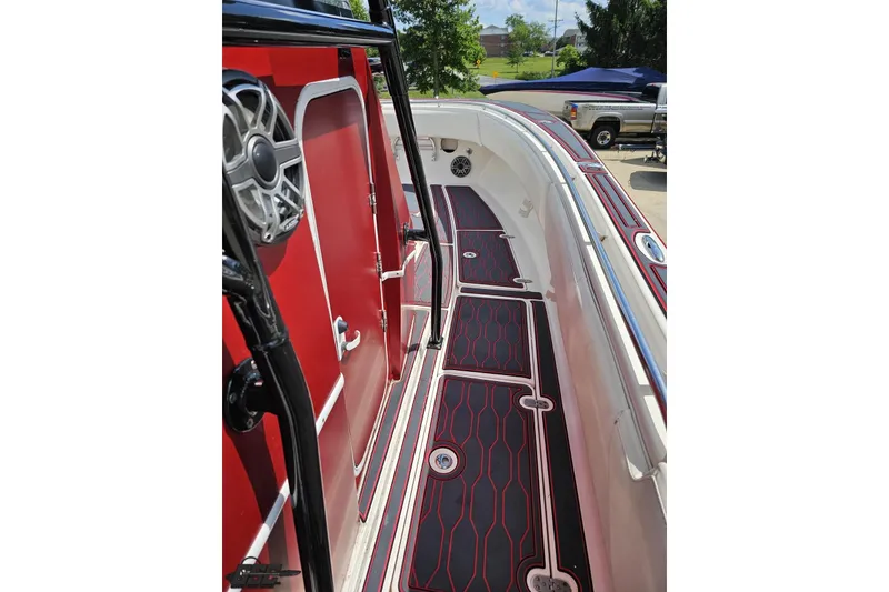 Slide: The Image of 2005 Fountain 34 Sportfish CC Open Bow with red and black deck design. - 75