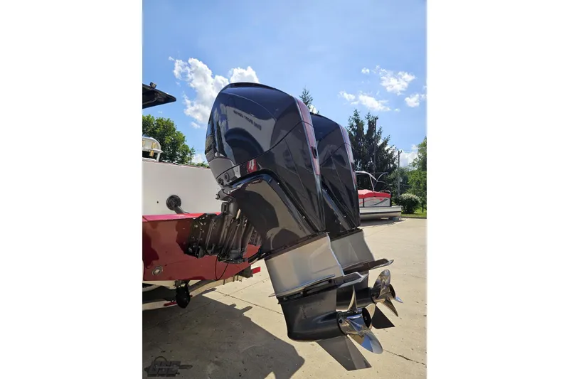 Slide: The Image of Twin outboard motors on a 2005 Fountain 34 Sportfish CC Open Bow boat. - 28