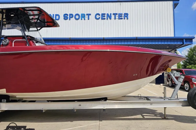 Slide: The Image of 2005 Fountain 34 Sportfish CC Open Bow boat on trailer at a sport center. - 11