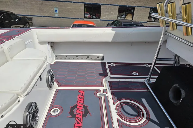 Slide: The Image of 2005 Fountain 34 Sportfish CC Open Bow interior with seating and rod holders. - 55