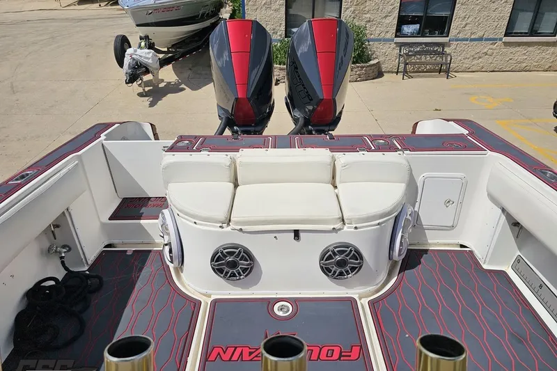 Slide: The Image of 2005 Fountain 34 Sportfish CC Open Bow with twin engines and cushioned seating. - 92