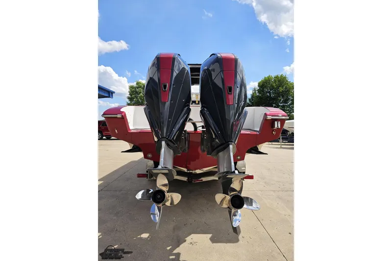 Slide: The Image of 2005 Fountain 34 Sportfish CC Open Bow with dual outboard motors, rear view. - 31