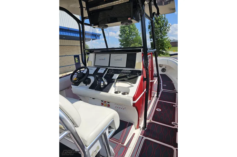 Slide: The Image of 2005 Fountain 34 Sportfish CC Open Bow boat cockpit with Garmin navigation system. - 60