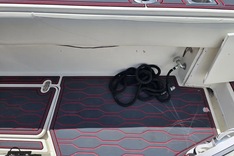 Slide: The Image of 2005 Fountain 34 Sportfish CC Open Bow interior with coiled rope and faucet. - 53