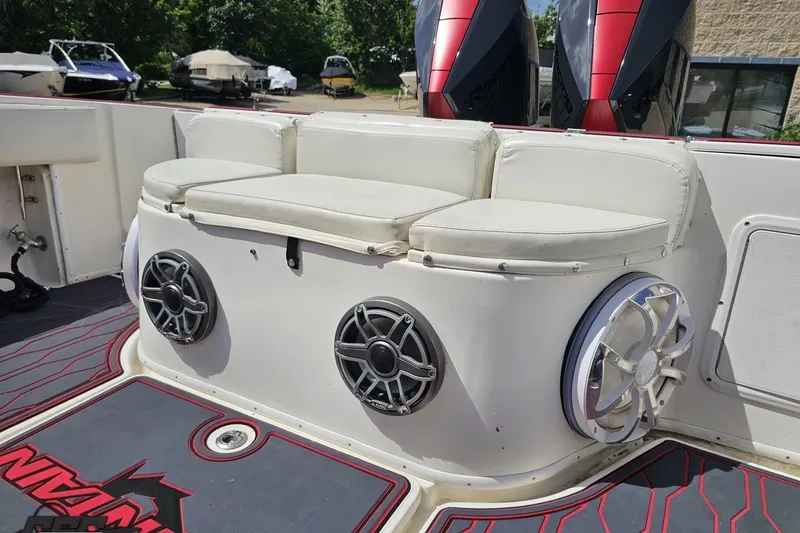 Slide: The Image of 2005 Fountain 34 Sportfish CC Open Bow with cushioned seating and marine speakers. - 91