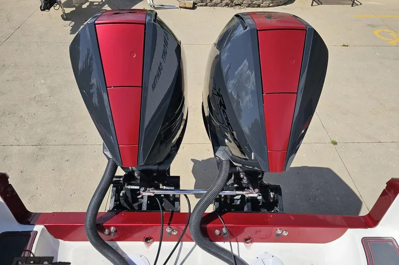 Slide: The Image of Twin outboard motors on a 2005 Fountain 34 Sportfish CC Open Bow boat. - 95