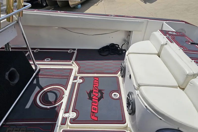 Slide: The Image of 2005 Fountain 34 Sportfish CC Open Bow interior with seating and branded flooring. - 52