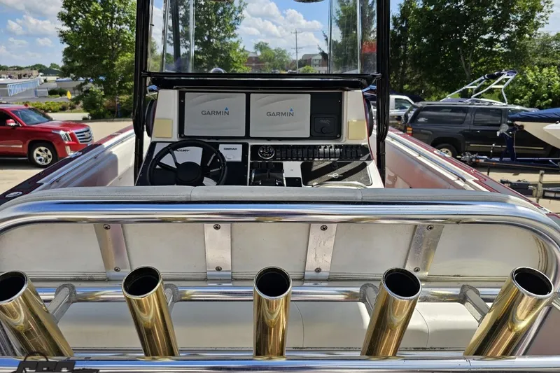 Slide: The Image of 2005 Fountain 34 Sportfish CC Open Bow with Garmin navigation, docked outdoors. - 57