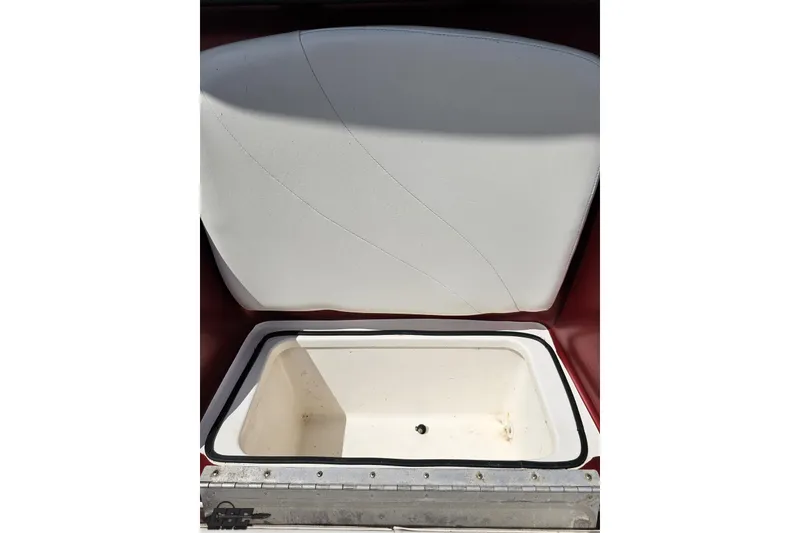 Slide: The Image of Open storage compartment on a 2005 Fountain 34 Sportfish CC Open Bow boat. - 83