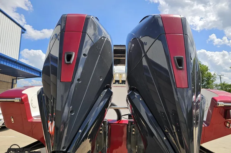 Slide: The Image of Twin outboard motors on a 2005 Fountain 34 Sportfish CC Open Bow boat. - 32