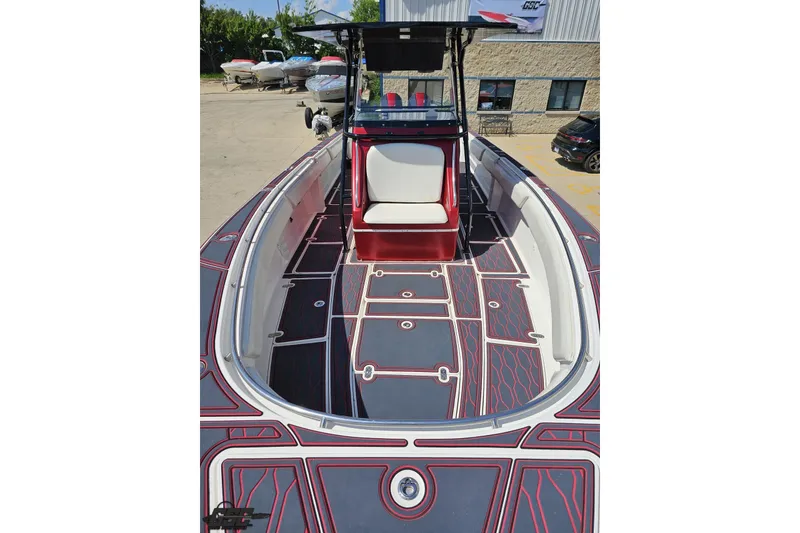 Slide: The Image of 2005 Fountain 34 Sportfish CC Open Bow with custom deck design in a marina setting. - 79