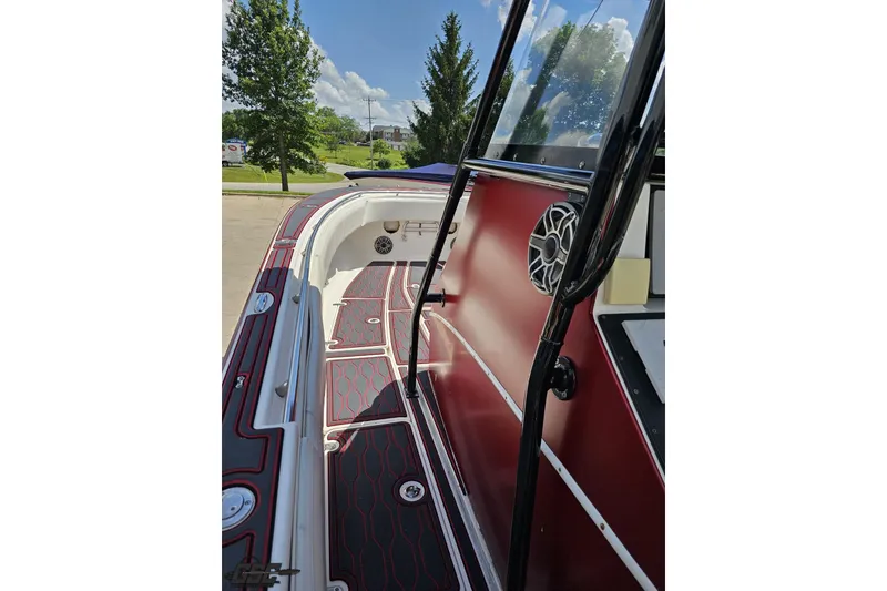 Slide: The Image of 2005 Fountain 34 Sportfish CC Open Bow, sleek interior with red accents and modern design. - 74