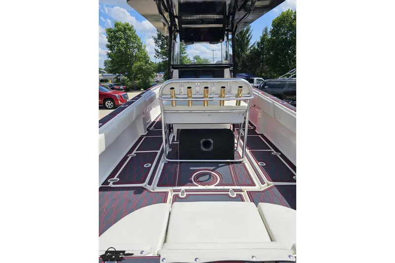 Slide: The Image of 2005 Fountain 34 Sportfish CC Open Bow boat interior with seating and rod holders. - 44