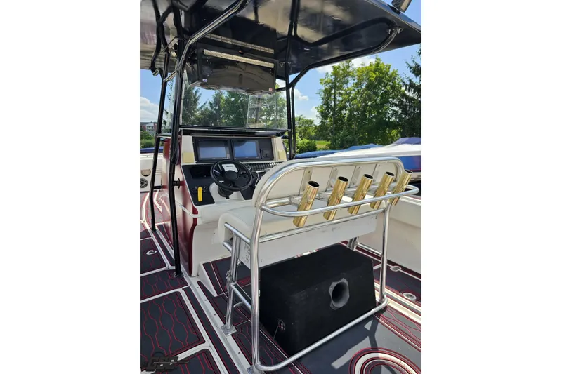 Slide: The Image of 2005 Fountain 34 Sportfish CC Open Bow helm with seating and rod holders. - 56
