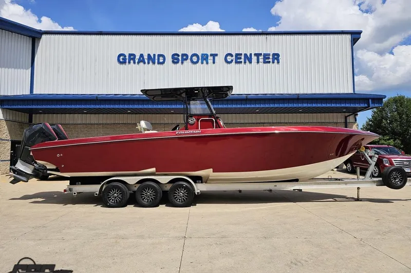 The Image of 2005 Fountain 34 Sportfish CC Open Bow boat on trailer at Grand Sport Center. - 1