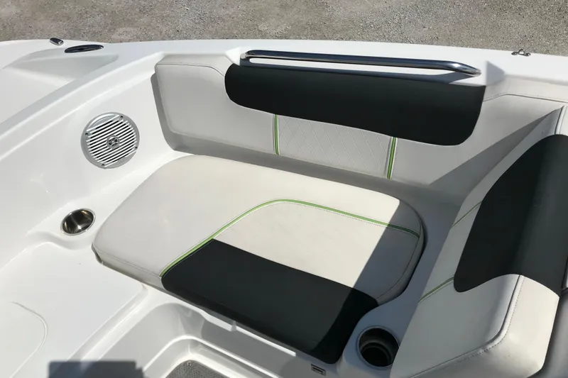 Slide: The Image of White and black seating area on a 2021 Tahoe 1950 boat with speaker and cup holder. - 16