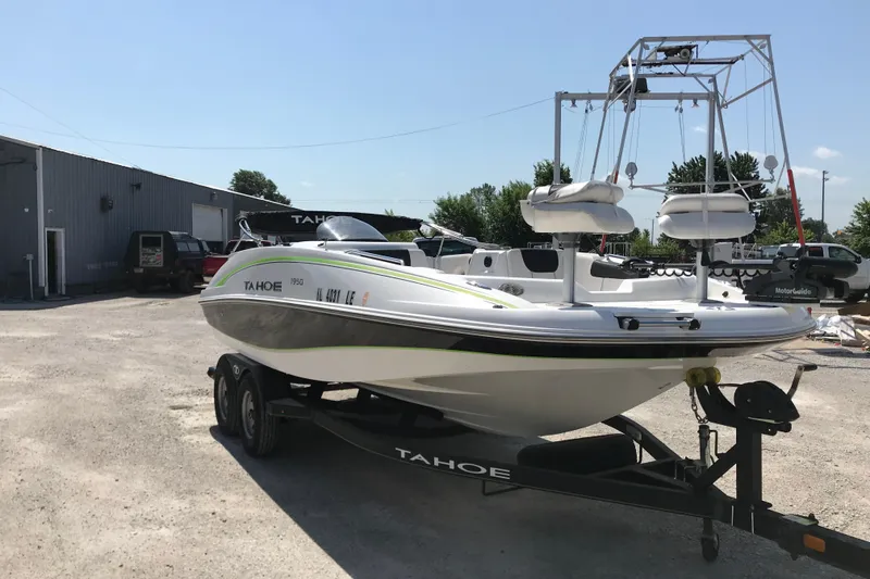 Slide: The Image of 2021 Tahoe 1950 boat on trailer in outdoor storage area. - 8