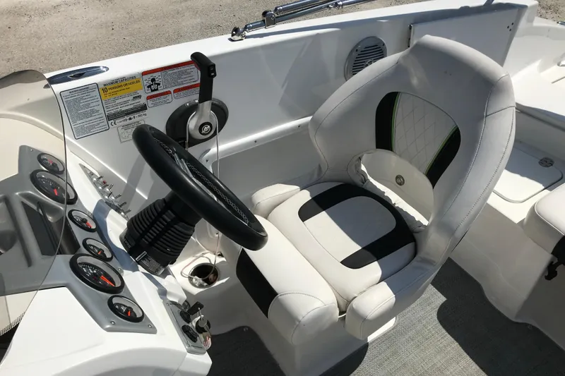 Slide: The Image of Cockpit of 2021 Tahoe 1950 boat with steering wheel and cushioned seat. - 21