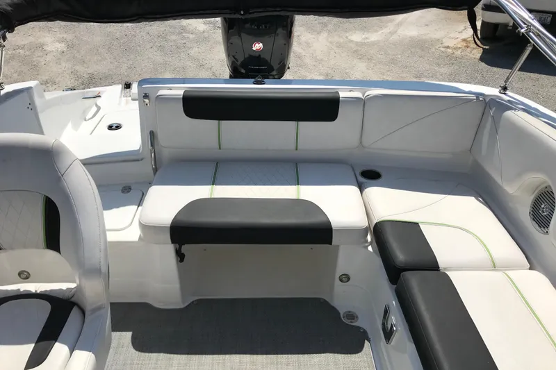 Slide: The Image of Interior of a 2021 Tahoe 1950 boat with white and black seating. - 20