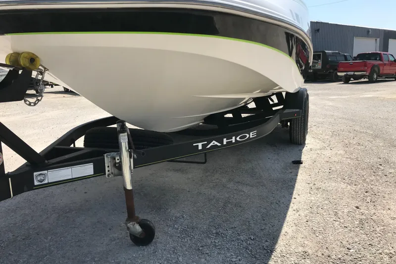 Slide: The Image of Trailer with 2021 Tahoe 1950 boat in a parking lot. - 6