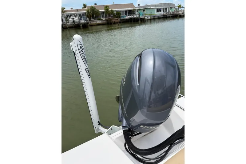 Slide: The Image of 2017 Sportsman Open 212 Center Console boat with Yamaha outboard motor on calm water. - 17