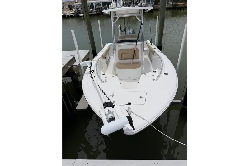 Slide: The Image of 2017 Sportsman Open 212 Center Console boat docked in a marina. - 6