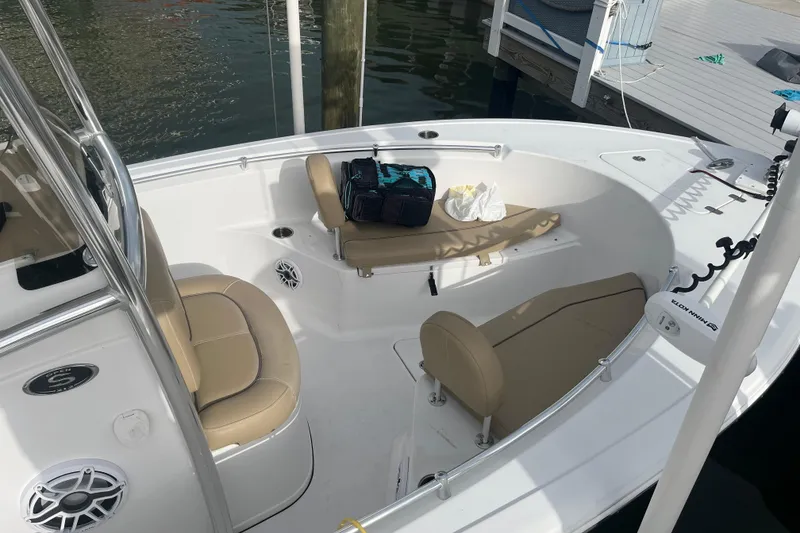 Slide: The Image of 2017 Sportsman Open 212 Center Console boat interior with seating and gear. - 28