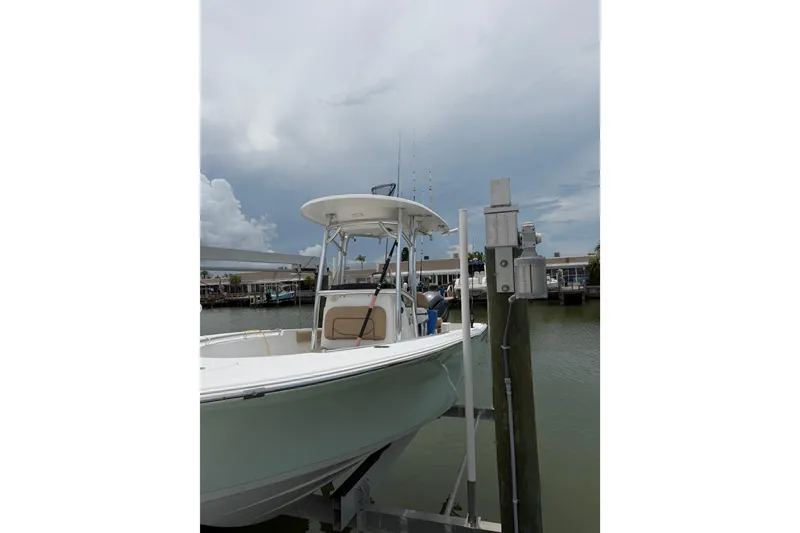 The Image of 2017 Sportsman Open 212 Center Console boat docked by the waterfront. - 0