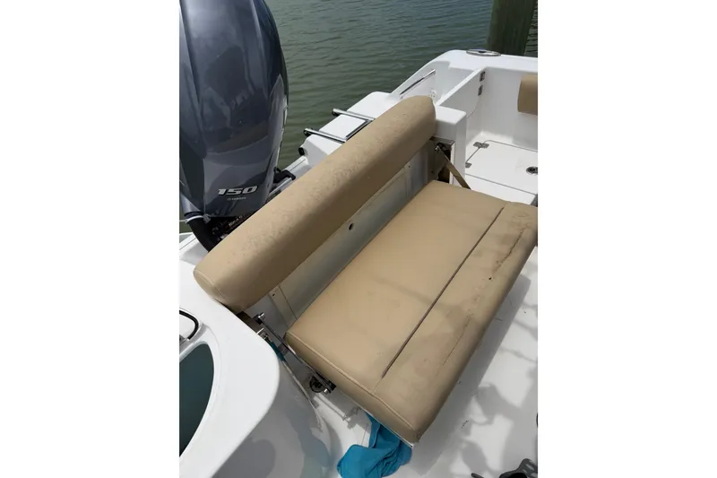 Slide: The Image of 2017 Sportsman Open 212 Center Console boat with beige seating and Yamaha 150 engine. - 25