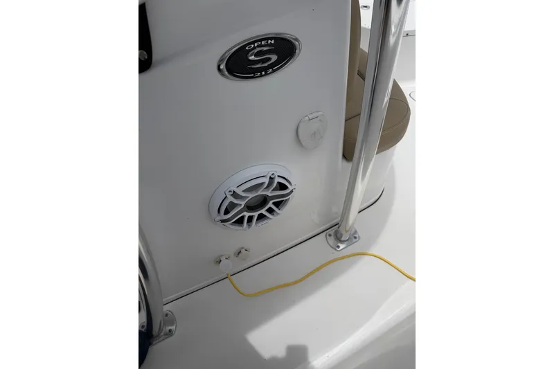 Slide: The Image of 2017 Sportsman Open 212 Center Console boat interior with speaker and railing. - 11