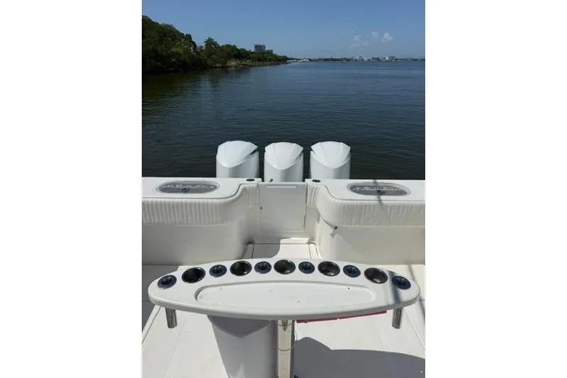 Slide: The Image of 2016 SeaHunter 41 Tournament boat with triple engines on calm water. - 14