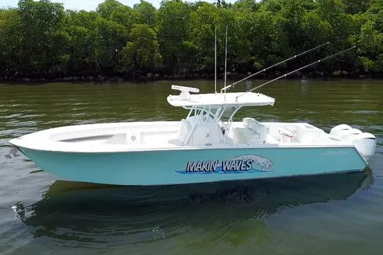 Slide: The Image of 2016 SeaHunter 41 Tournament boat on calm water, featuring "Makin' Waves" graphic. - 4