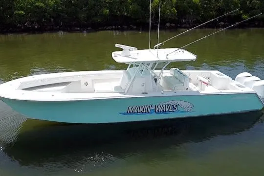 Slide: The Image of 2016 SeaHunter 41 Tournament boat on calm water, featuring "Makin' Waves" graphic. - 8